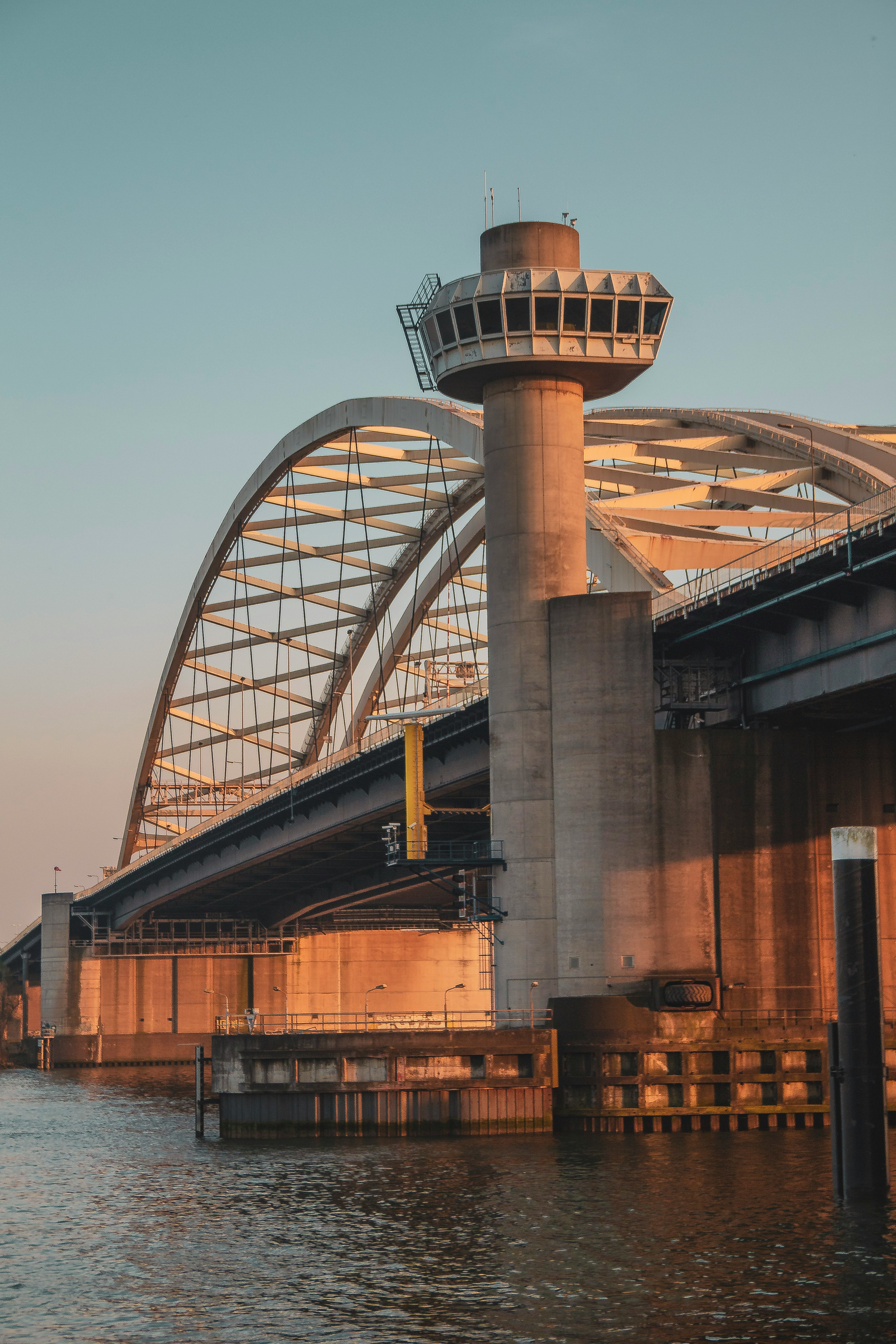 gray concrete bridge over river during daytime